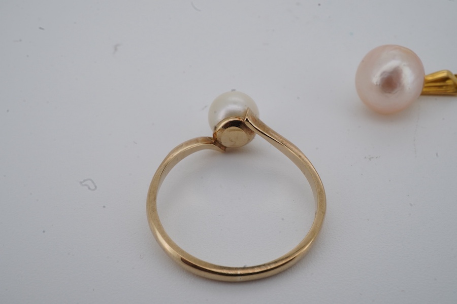 A cultured pearl ring and pendant, each set with a cultured pearl, the ring in 9ct gold, size N1/2, British hallmarks, gross weight approximately 1.5 grams, pendant length 1.7cm